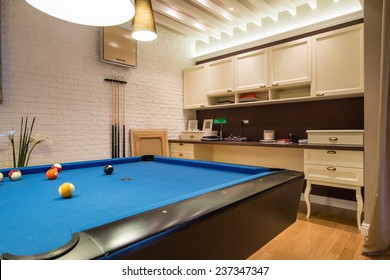 Interior of a living room with pool table - Powered by Shutterstock