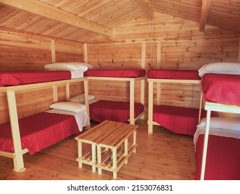 Interior Of A Log Cabin With Bunk Beds