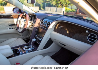 Interior of the Luxury car in a light and white colours