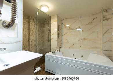 Interior of a luxury hotel bathroom with hydromassage bathtub
