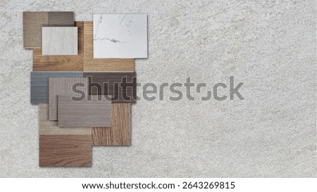 interior material samples in top view includings marble quartz, wooden vinyl flooring tiles, wooden veneer, ceramic travertine stone tile placed on grey cement stone with blank space for design.