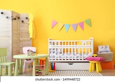 Interior Of Modern Baby Room With Crib