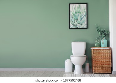 Interior of modern bathroom with floral decor - Shutterstock ID 1879502488