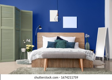 Interior Of Modern Bedroom With Blue Wall