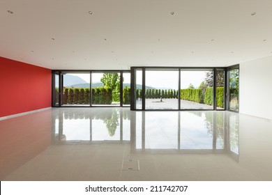 Interior modern building, wide living room with windows