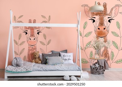 Interior of modern children's room with comfortable bed and paintings of cute giraffe on wall