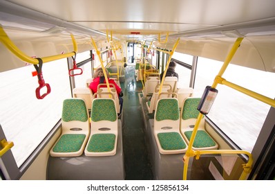 Interior Of Modern City Bus. Seat Places In Back Side Of Bus. Wide Angle Shot