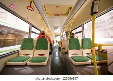 Interior Of Modern City Bus. Seat Places In Back Side Of Bus. Wide Angle Shot