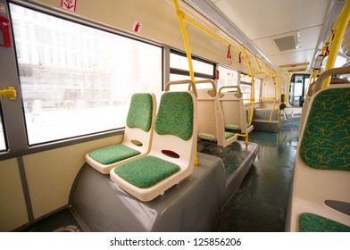 Interior Of Modern City Bus. Seat Places In Back Side Of Bus. Wide Angle Shot