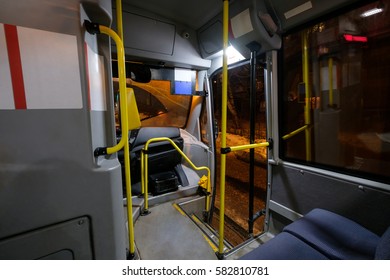 Interior Of Modern City Mini Bus Wide Angle Shot With Seats And Open Front Door In Winter Night