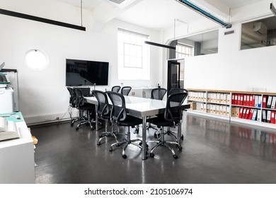 Interior of modern conference room with table and swivel chairs, copy space. unaltered, business, modern office and absence concept.