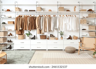 Interior of modern dressing room with wardrobe boxes, stylish clothes and accessories - Powered by Shutterstock