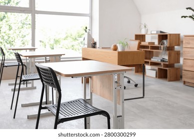Interior of modern empty classroom prepared for exam