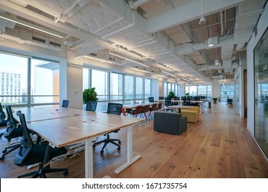 Interior of modern empty office building.Open ceiling design. - Shutterstock ID 1671735754