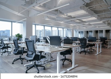 Interior of modern empty office building.Open ceiling design. - Shutterstock ID 1675204894
