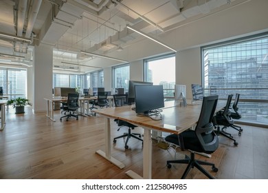 Interior of modern empty office building.Open ceiling design. - Shutterstock ID 2125804985