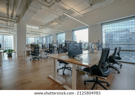 Interior of modern empty office building.Open ceiling design.