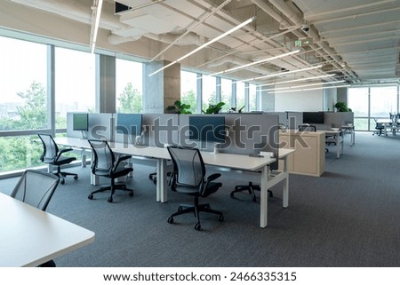Interior of modern empty office building.Open ceiling design.Equipped with automatic lifting table and LCD screen.