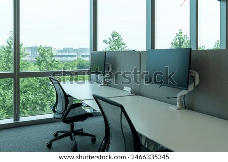 Interior of modern empty office building.Open ceiling design.Equipped with automatic lifting table and LCD screen.