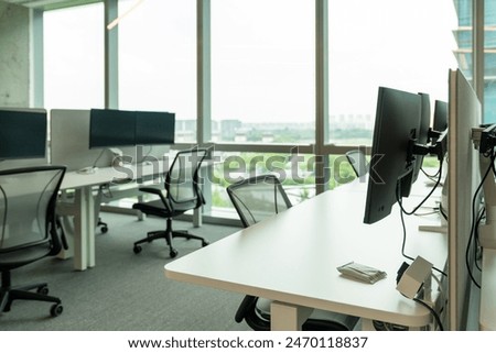 Interior of modern empty office building.Open ceiling design.Equipped with automatic lifting table and LCD screen.