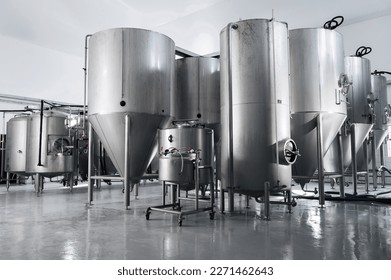 interior of a modern factory brewery with tanks inside - Powered by Shutterstock