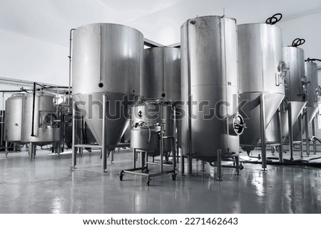 interior of a modern factory brewery with tanks inside