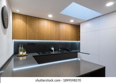 Interior of modern kitchen with built-in appliances in a house