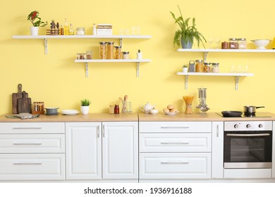 Interior of modern kitchen with shelves