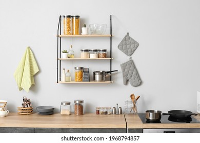 Interior of modern kitchen with shelves