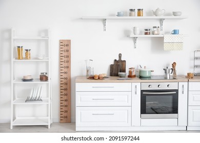 Interior of modern kitchen with stadiometer