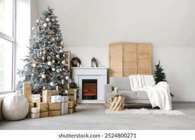 Interior of modern living room with fireplace decorated for Christmas - Powered by Shutterstock