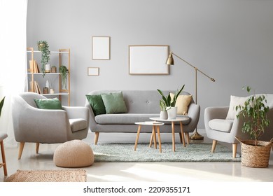 Interior of modern living room with houseplants, sofa and armchairs - Shutterstock ID 2209355171