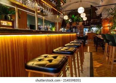 Interior Of Modern Loft Style Restaurant. Bar Counter. Interior Porch With Fresh Flowers