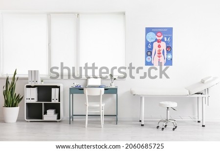 Interior of modern medical office with doctor's workplace and big window