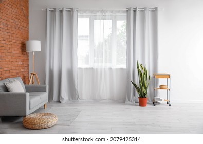 Interior of modern room with light curtains