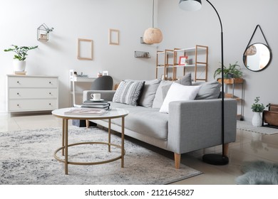 Interior of modern room with stylish sofa - Shutterstock ID 2121645827