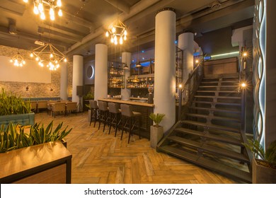 Interior Of Modern Urban Cafe Or Restaurant Interior With Dining Places And Bar Counter, No People, Copy Space