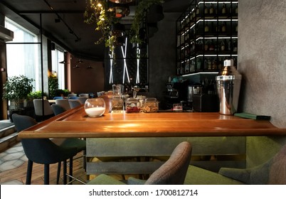 Interior Of A Modern Urban Restaurant With Half-lighted Bar Counter, No People, Quarantine, Copy Space