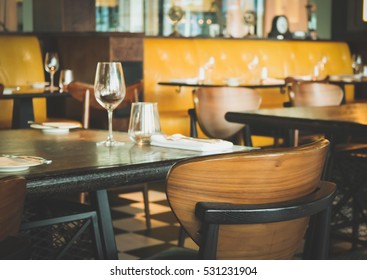 Interior Of Modern Vintage Restaurant In Vintage Tone, Empty Glasses Set On The Table.