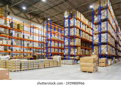 Interior of a modern warehouse storage of retail shop with pallet truck near shelves - Shutterstock ID 1929800966