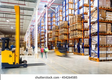 Interior Of A Modern Warehouse In Time With The Staff