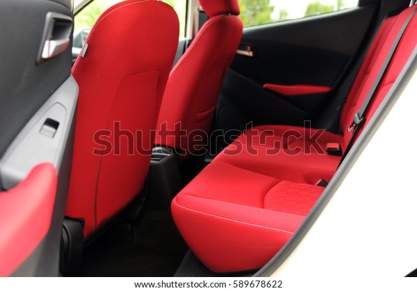 Interior of the new car.\
Red rear seats.