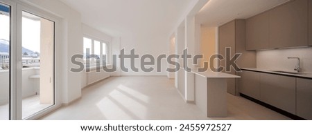 Interior of a new empty modern kitchen in brown beige. Empty flat, no furniture. Great attention to detail. 