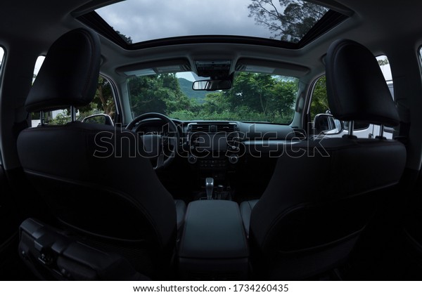 Interior of a off\
road car in the rainy\
nature