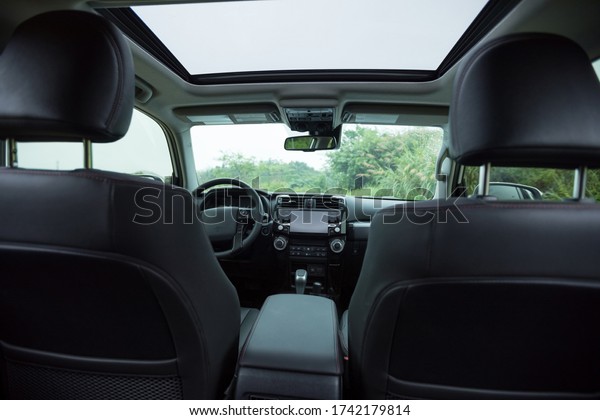 Interior of off road\
car in the rainy\
nature
