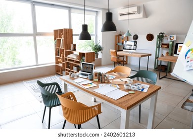 Interior of office with graphic designer's workplaces