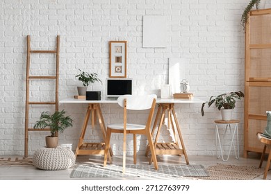 Interior of office with workplace and aroma diffuser