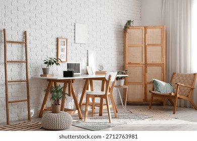 Interior of office with workplace and aroma diffuser