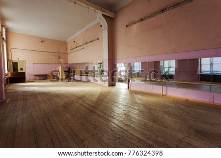 interior of old abandoned Gym for ballet training. An old abandoned ballet studio, an impostor class. abandoned gym of Soviet building of times  interior of an old abandoned building. Ballet room