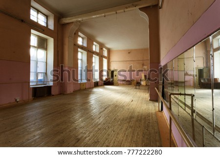 interior of old abandoned Gym for ballet training. An old abandoned ballet studio, an impostor class. abandoned gym of Soviet building of times USSR. interior of an old abandoned building. Ballet room
